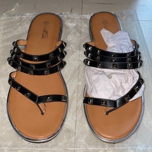 Brand new, black sandal size 10